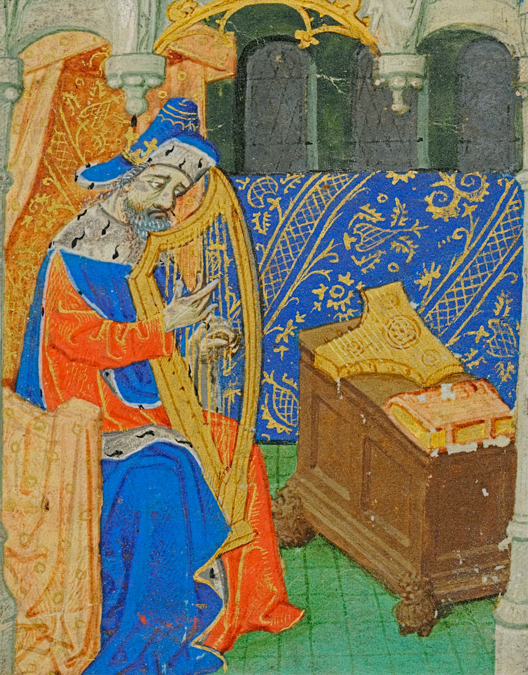 Medieval scholar writing at a desk surrounded by manuscripts and books